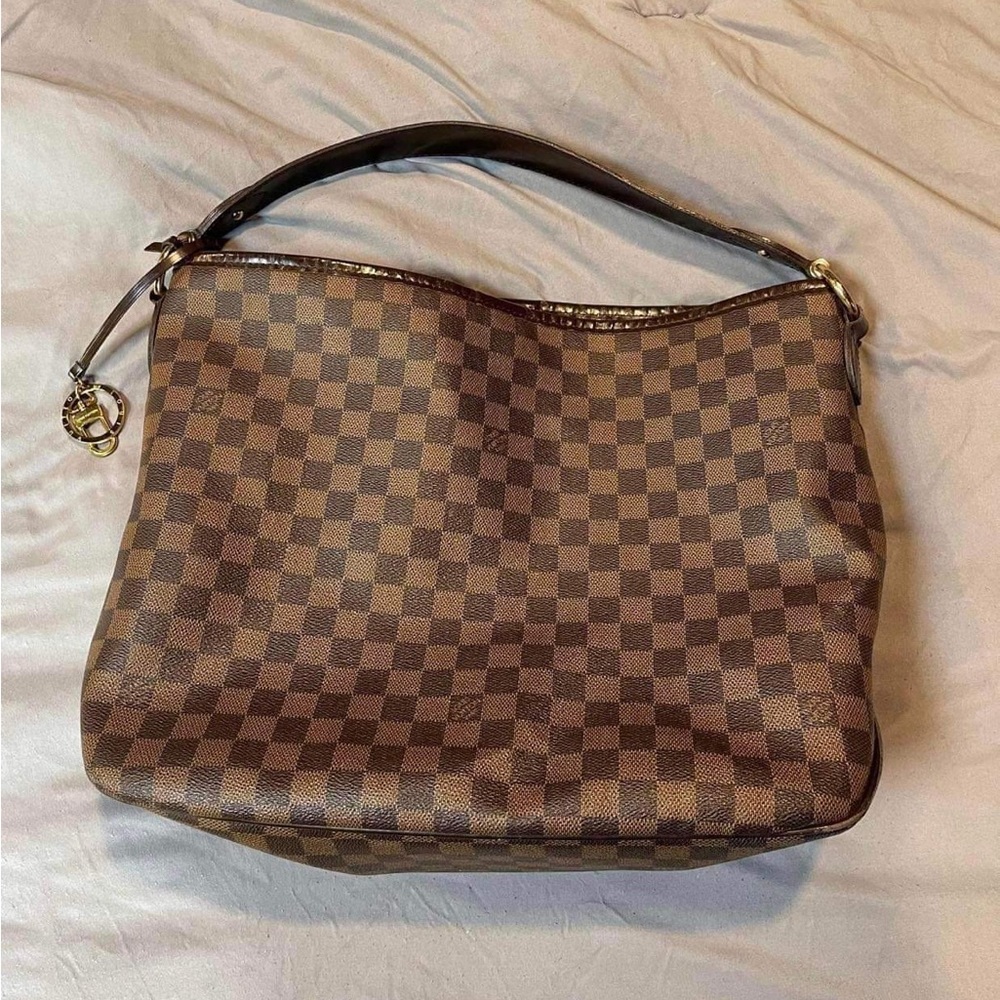 Authentic Louis Vuitton.